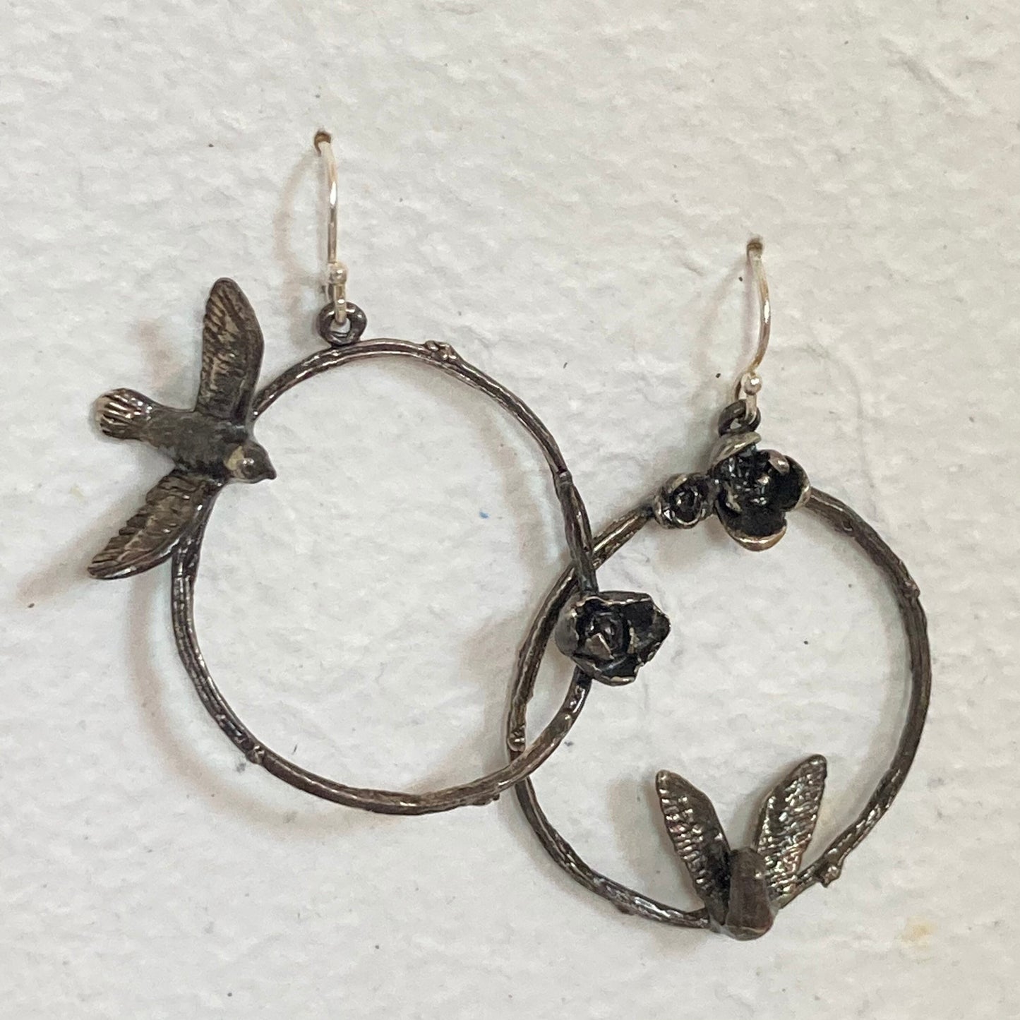 Asymmetric bird, flower, and twig sterling earrings