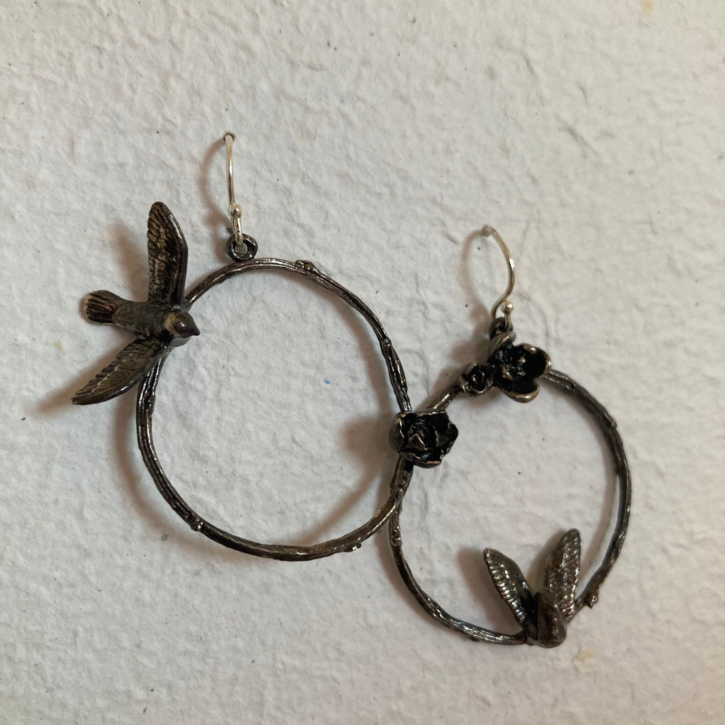 Asymmetric bird, flower, and twig sterling earrings