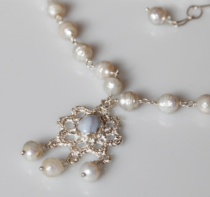 Crocheted silver lace pendant