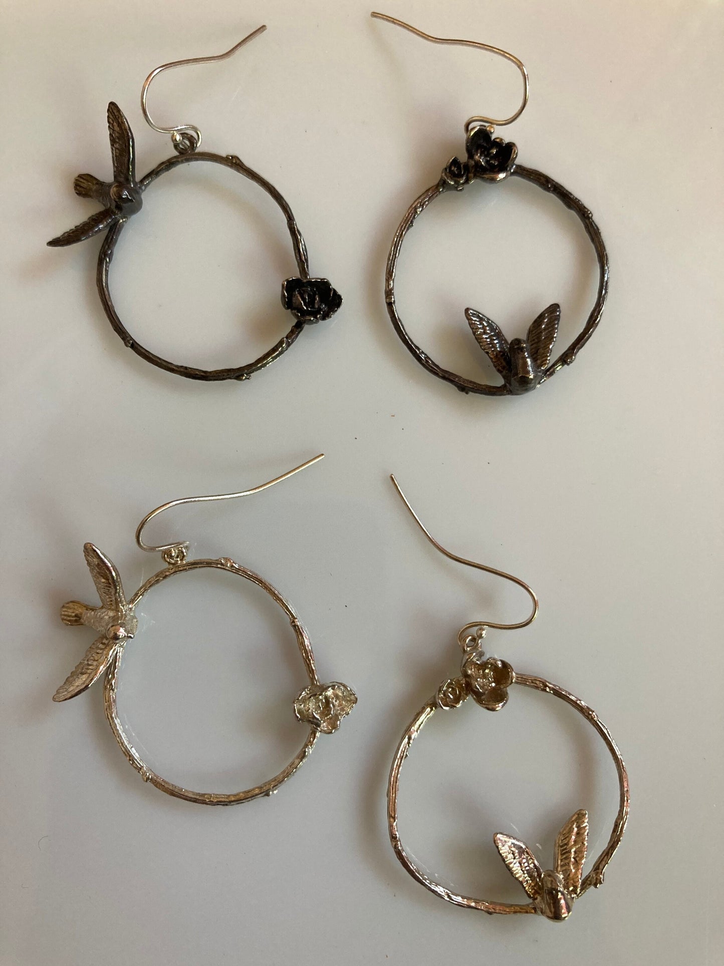 Asymmetric bird, flower, and twig sterling earrings