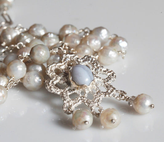 Crocheted silver lace pendant
