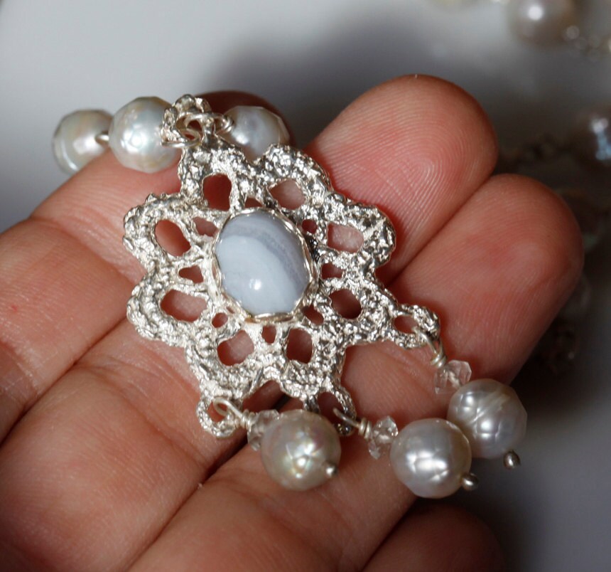 Crocheted silver lace pendant