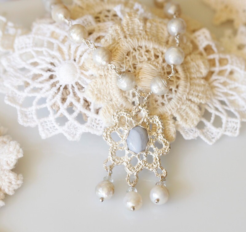 Crocheted silver lace pendant